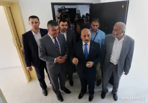 Palestinian Minister of public works and housing, Mofeed al-Hasayna, attends the distribution ceremony the 40 housing units funded by the Saudi Fund for the Palestinians, whose house was destroyed by what witnesses said...