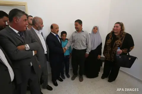 Palestinian Minister of public works and housing, Mofeed al-Hasayna, attends the distribution ceremony the 40 housing units funded by the Saudi Fund for the Palestinians, whose house was destroyed by what witnesses said...