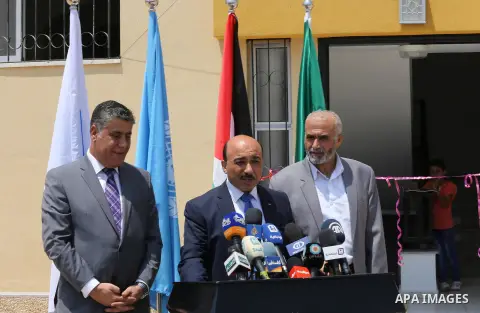 Palestinian Minister of public works and housing, Mofeed al-Hasayna, speaks during a distribution ceremony the 40 housing units funded by the Saudi Fund for the Palestinians, whose house was destroyed by what witnesses s...