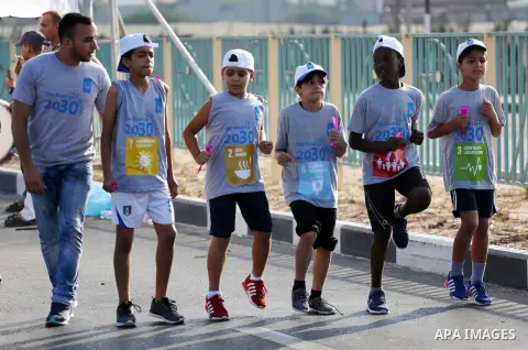Palestinian children take part in a marathon to mark the International Youth Day, in Gaza city, on Aug. 12, 2016. Photo by Mohammed Asad