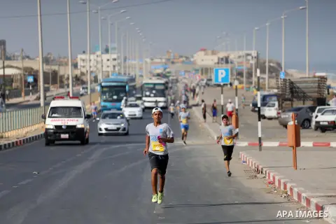Palestinian youths take part in a marathon to mark the International Youth Day, in Gaza city, on Aug. 12, 2016. Photo by Mohammed Asad