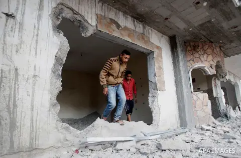 Relatives check the damage to the family house of Palestinian assailant Mohammad Tarayra after it was partially blown up by Israeli troops in the West Bank village of Bani Naem, east of Hebron August 15, 2016. Photo by W...