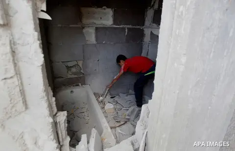 Relatives check the damage to the family house of Palestinian assailant Mohammad Tarayra after it was partially blown up by Israeli troops in the West Bank village of Bani Naem, east of Hebron August 15, 2016. Photo by W...