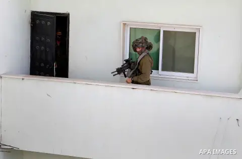 Israeli soldiers conduct searches in the Palestinian al-Fawwar refugee camp, south of the West Bank city of Hebron, on August 16, 2016. Twenty-five Palestinians were wounded in clashes with Israeli soldiers conducting se...
