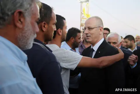 Palestininan Prime Minister, Rami Hamdallah, attends the funeral of the martyr Mohammed Abu Hashash and Naim Ahawamrh, in the West bank city of Ramallah on August 19, 2016. Photo by Prime Minister Office