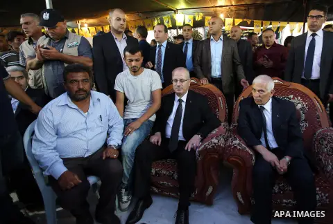 Palestininan Prime Minister, Rami Hamdallah, attends the funeral of the martyr Mohammed Abu Hashash and Naim Ahawamrh, in the West bank city of Ramallah on August 19, 2016. Photo by Prime Minister Office
