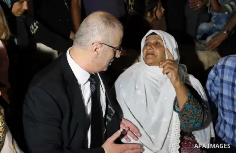 Palestininan Prime Minister, Rami Hamdallah, attends the funeral of the martyr Mohammed Abu Hashash and Naim Ahawamrh, in the West bank city of Ramallah on August 19, 2016. Photo by Prime Minister Office