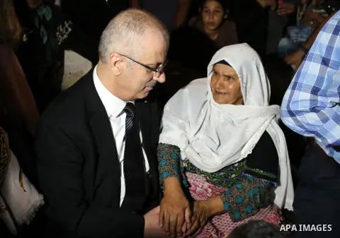 Palestininan Prime Minister, Rami Hamdallah, attends the funeral of the martyr Mohammed Abu Hashash and Naim Ahawamrh, in the West bank city of Ramallah on August 19, 2016. Photo by Prime Minister Office