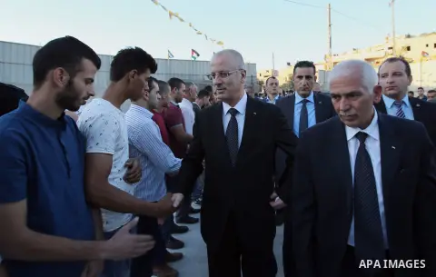 Palestininan Prime Minister, Rami Hamdallah, attends the funeral of the martyr Mohammed Abu Hashash and Naim Ahawamrh, in the West bank city of Ramallah on August 19, 2016. Photo by Prime Minister Office