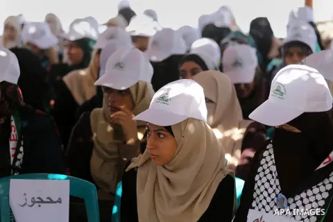 Palestinian women attend the opening of the Jerusalem Committee camps ceremony, in Gaza city, on August 21, 2016. Photo by Mohammed Asad