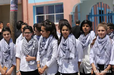 Palestinian band Sanawnaw, who were denied access to perform the festival at Bethlehem, take part in a protest against the denial in Beit Hanun, near the Erez crossing point with Israel, in the northern Gaza Strip on Aug...