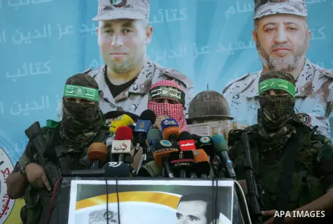 Spokesman of al-Qassam Brigades, the military wing of Hamas movement, Abu Obeida speaks during an anti-Israel military parade staged by members of al-Qassam Brigades, the armed wing of the Hamas movement, in Rafah in the...