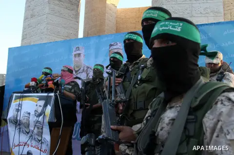 Spokesman of al-Qassam Brigades, the military wing of Hamas movement, Abu Obeida speaks during an anti-Israel military parade staged by members of al-Qassam Brigades, the armed wing of the Hamas movement, in Rafah in the...