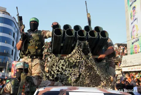 Palestinian members of al-Qassam Brigades, the armed wing of the Hamas movement, take part during an anti-Israel military parade, in Rafah in the southern Gaza Strip August 21, 2016. Photo by Abed Rahim Khatib