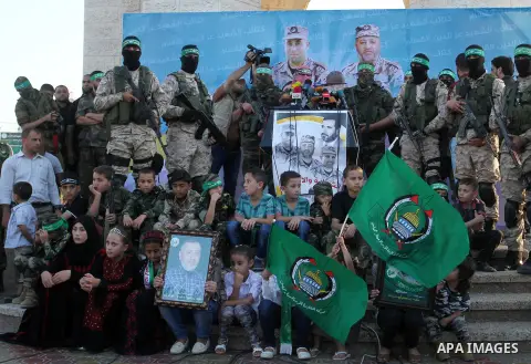 Spokesman of al-Qassam Brigades, the military wing of Hamas movement, Abu Obeida speaks during an anti-Israel military parade staged by members of al-Qassam Brigades, the armed wing of the Hamas movement, in Rafah in the...