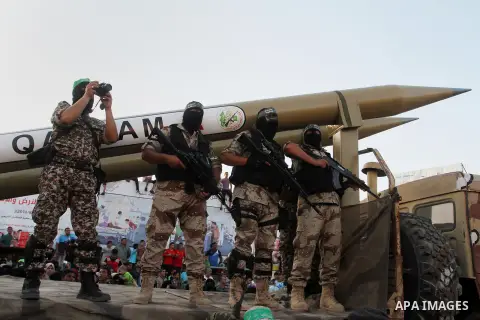 Palestinian members of al-Qassam Brigades, the armed wing of the Hamas movement, display home-made rockets during an anti-Israel military parade, in Rafah in the southern Gaza Strip August 21, 2016. Photo by Abed Rahim K...