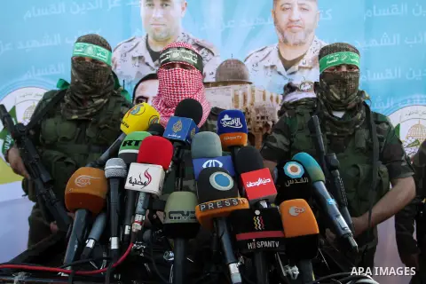 Spokesman of al-Qassam Brigades, the military wing of Hamas movement, Abu Obeida speaks during an anti-Israel military parade staged by members of al-Qassam Brigades, the armed wing of the Hamas movement, in Rafah in the...