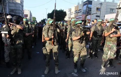 Palestinian members of al-Qassam Brigades, the armed wing of the Hamas movement, take part during an anti-Israel military parade, in Rafah in the southern Gaza Strip August 21, 2016. Photo by Abed Rahim Khatib