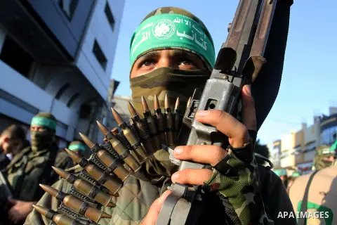 Palestinian members of al-Qassam Brigades, the armed wing of the Hamas movement, take part during an anti-Israel military parade, in Rafah in the southern Gaza Strip August 21, 2016. Photo by Abed Rahim Khatib