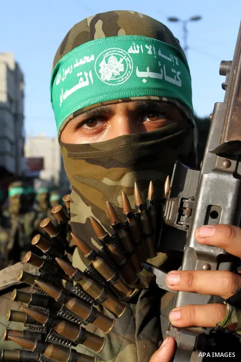 Palestinian members of al-Qassam Brigades, the armed wing of the Hamas movement, take part during an anti-Israel military parade, in Rafah in the southern Gaza Strip August 21, 2016. Photo by Abed Rahim Khatib