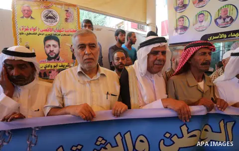 Palestinians take part in a protest demanding release the prisoners in Israeli jails, in front of Red cross office in Gaza city, on August 22, 2016. Photo by Mohammed Asad