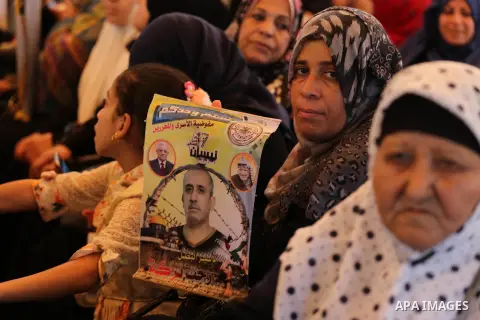 Palestinians take part in a protest demanding release the prisoners in Israeli jails, in front of Red cross office in Gaza city, on August 22, 2016. Photo by Mohammed Asad