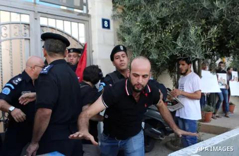 A Palestinian Protesters Argues with Palestinian security during a protest against administrative detention and in support of Palestinian prisoner Bilal Kayed ,who has been fasting for almost two months over his detentio...