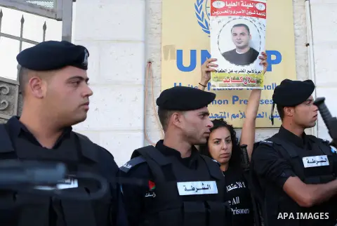 A Palestinian Protesters Argues with Palestinian security during a protest against administrative detention and in support of Palestinian prisoner Bilal Kayed ,who has been fasting for almost two months over his detentio...