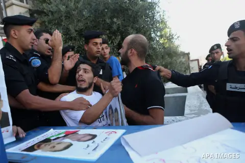 A Palestinian Protesters Argues with Palestinian security during a protest against administrative detention and in support of Palestinian prisoner Bilal Kayed ,who has been fasting for almost two months over his detentio...