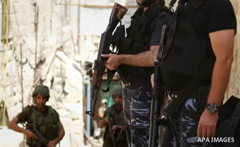 Members of the Palestinian security forces patrol in the West Bank city of Nablus on August 22, 2016 during ongoing clashes between the security forces and Palestinian gunmen. Palestinian security forces detained two Nab...