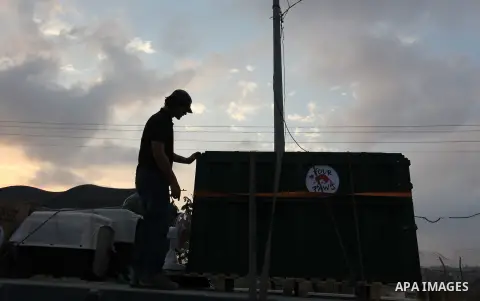 Members of the international animal welfare charity "Four Paws" transport animals across the Erez border crossing into Israel after evacuating them from the zoo in Khan Yunis in the southern Gaza Strip on August 24, 2016...