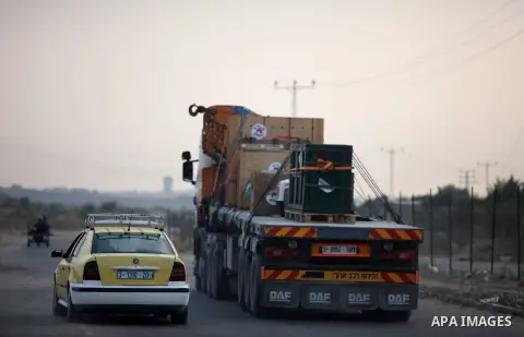 Members of the international animal welfare charity "Four Paws" transport animals across the Erez border crossing into Israel after evacuating them from the zoo in Khan Yunis in the southern Gaza Strip on August 24, 2016...