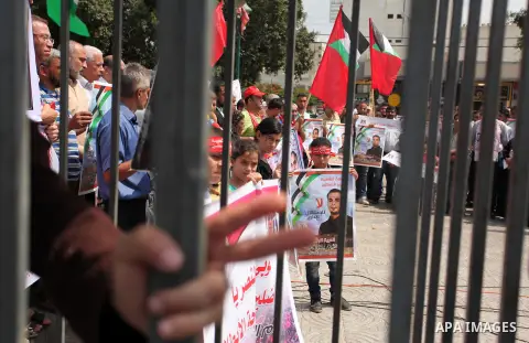 Supporters of the Popular Front for the Liberation of Palestine (PFLP) take part in a celebration of Bilal Kayed, in Gaza city on August 25, 2016. Palestinian prisoner Bilal Kayid has suspended his hunger strike after sp...