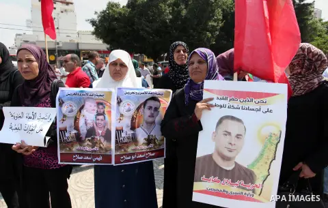 Supporters of the Popular Front for the Liberation of Palestine (PFLP) take part in a celebration of Bilal Kayed, in Gaza city on August 25, 2016. Palestinian prisoner Bilal Kayid has suspended his hunger strike after sp...
