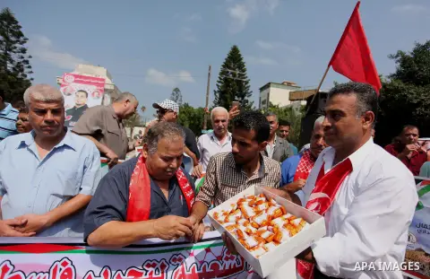 Supporters of the Popular Front for the Liberation of Palestine (PFLP) take part in a celebration of Bilal Kayed, in Gaza city on August 25, 2016. Palestinian prisoner Bilal Kayid has suspended his hunger strike after sp...