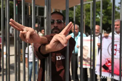 Supporters of the Popular Front for the Liberation of Palestine (PFLP) take part in a celebration of Bilal Kayed, in Gaza city on August 25, 2016. Palestinian prisoner Bilal Kayid has suspended his hunger strike after sp...