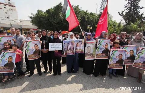 Supporters of the Popular Front for the Liberation of Palestine (PFLP) take part in a celebration of Bilal Kayed, in Gaza city on August 25, 2016. Palestinian prisoner Bilal Kayid has suspended his hunger strike after sp...