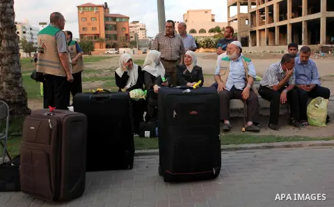 Palestinians wait to leave Gaza for the annual Hajj pilgrimage in Mecca, in Gaza City August 30, 2016. Photo by Ashraf Amra