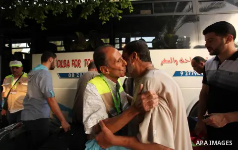 A Palestinian man bids farewell to his brother, who is preparing to leave for the annual Hajj pilgrimage in Mecca, in Gaza City August 30, 2016. Photo by Ashraf Amra