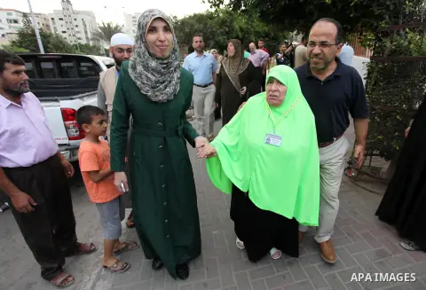 Palestinians wait to leave Gaza for the annual Hajj pilgrimage in Mecca, in Gaza City August 30, 2016. Photo by Ashraf Amra