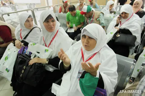Palestinian Muslim pilgrims wait at the Rafah border crossing between Egypt and the southern Gaza Strip, on August 30, 2016 ahead of their departure to the annual Hajj pilgrimage in Saudi Arabia's holy city of Mecca. Pho...
