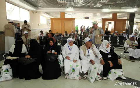 Palestinian Muslim pilgrims wait at the Rafah border crossing between Egypt and the southern Gaza Strip, on August 30, 2016 ahead of their departure to the annual Hajj pilgrimage in Saudi Arabia's holy city of Mecca. Pho...