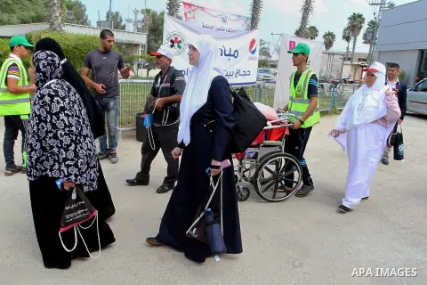 Palestinian Muslim pilgrims arrive at the Rafah border crossing between Egypt and the southern Gaza Strip, on August 31, 2016 ahead of their departure to the annual Hajj pilgrimage in Saudi Arabia's holy city of Mecca. P...