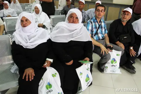 Palestinian Muslim pilgrims wait at the Rafah border crossing between Egypt and the southern Gaza Strip, on August 31, 2016 ahead of their departure to the annual Hajj pilgrimage in Saudi Arabia's holy city of Mecca. Pho...