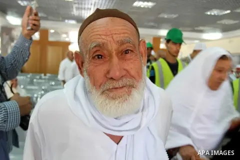 Palestinian Muslim pilgrims wait at the Rafah border crossing between Egypt and the southern Gaza Strip, on August 31, 2016 ahead of their departure to the annual Hajj pilgrimage in Saudi Arabia's holy city of Mecca. Pho...