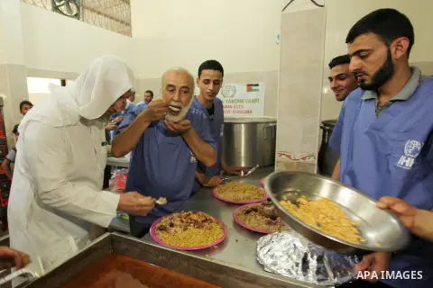 Chairman of Turkish humanitarian relief (IHH), Mohammed Kaya, attends the opening ceremony of a kitchen martyrs of the Freedom Flotilla (Mavi Marmara), which provides free meals for poor families, in Gaza city, on Sept....