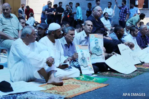Palestinian supporters of the Islamic Jihad Movement attend Friday prayers to show solidarity with Palestinian prisoners in Israeli Jails, in front of Red cross office in Gaza city, on Sep. 02, 2016. Photo by Mohammed As...