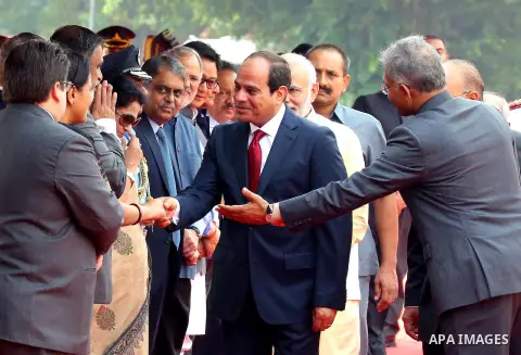 Egypt's President Abdel Fattah al-Sisi prepares to shake hand with officials during the ceremonial reception at presidential palace in New Delhi on September 2, 2016. al-Sisi is on a three-day state visit in India. Photo...