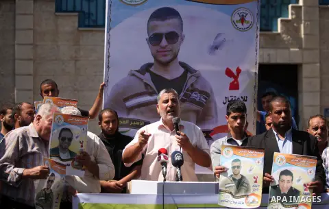 Palestinians hold banners during a protest to show solidarity with Palestinian prisoners on hunger strike in Israeli Jails, in front of the high commissioner for human rights headquarters in Gaza City, on Sept. 04, 2016....