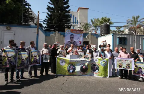 Palestinians hold banners during a protest to show solidarity with Palestinian prisoners on hunger strike in Israeli Jails, in front of the high commissioner for human rights headquarters in Gaza City, on Sept. 04, 2016....